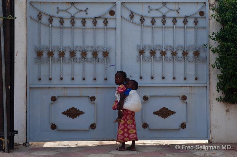20090528_150410 D3 P2 P2.jpg - Young girl carrying baby, Dakar